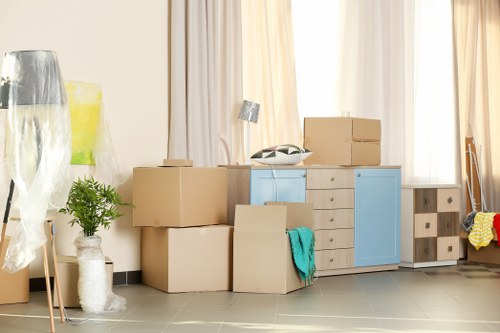 Furniture removals team handling a sofa move in Ealing