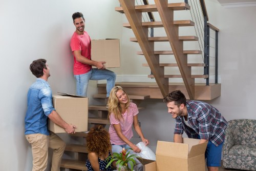 Professional movers organizing furniture for transport