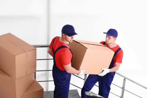Careful moving of furniture in a typical Ealing residential property