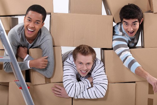 Packed household boxes and furniture prepared for a move in Ealing