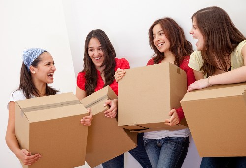 Local moving team handling furniture loading in Ealing