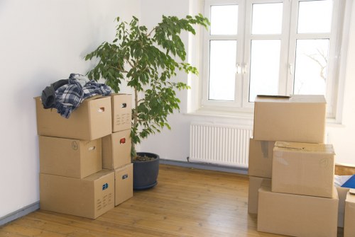 Preparation checklist and packed household boxes ready for house removals in Ealing