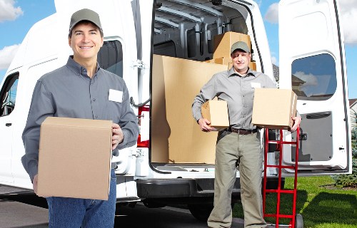 Staff carrying boxes with protective moving equipment