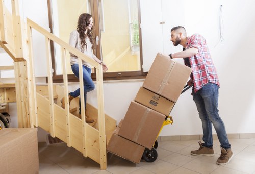 Careful transport of an upright piano through a residential property