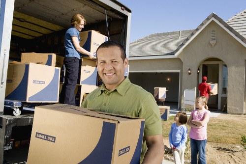 Packed office furniture and boxes ready for a business move