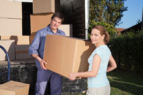 Careful loading of boxes into a removal van